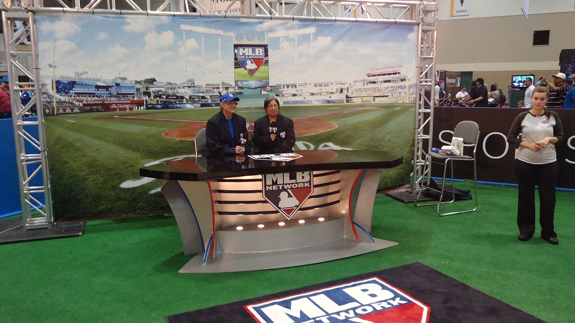 2 people sit at the interview desk in the MLB Network booth