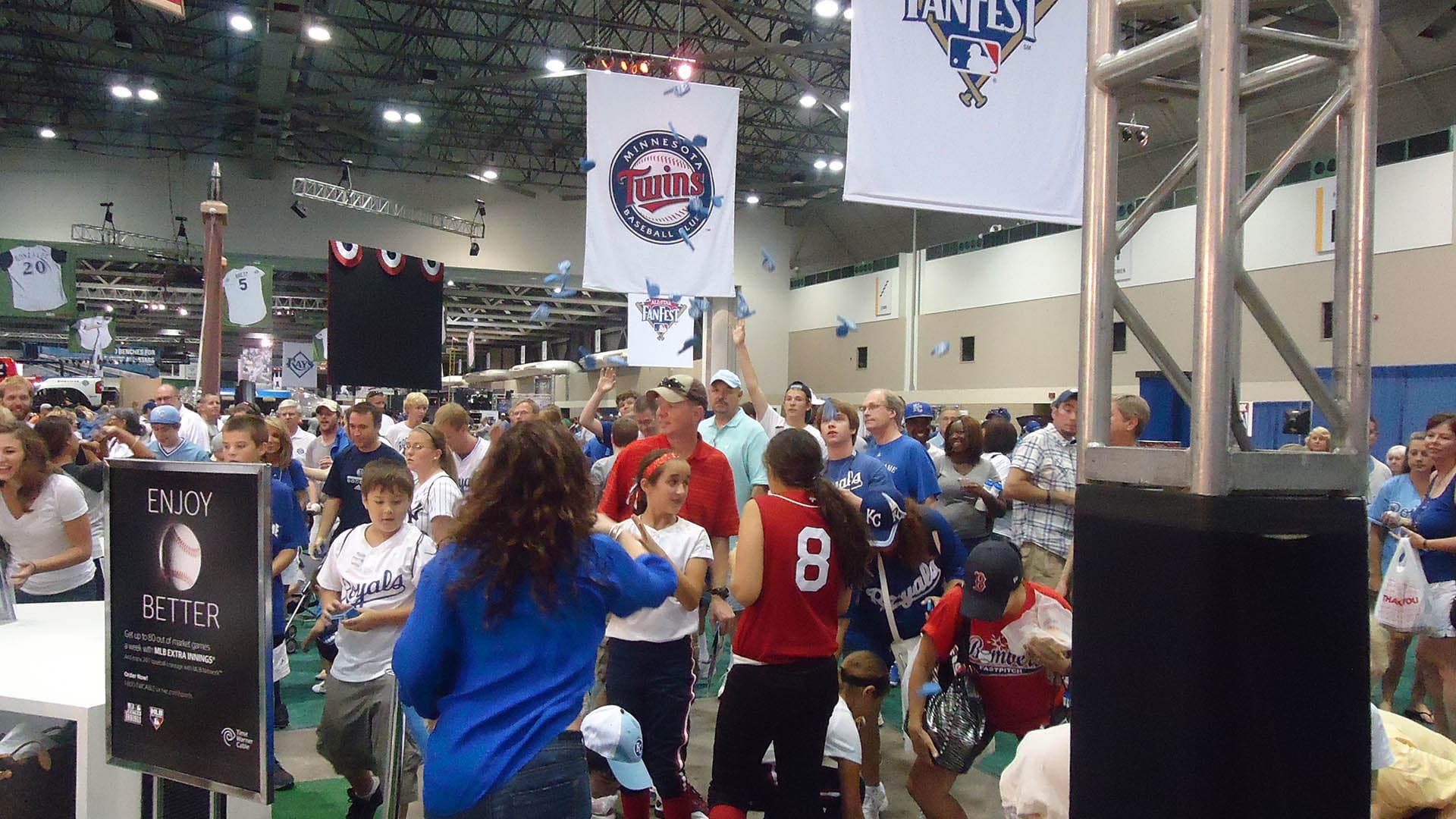 People waiting in line for the MLB Network booth at an event.