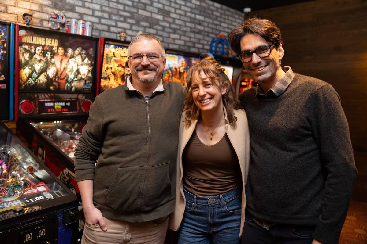 Ariel and Shaun and Evan smiling at camera