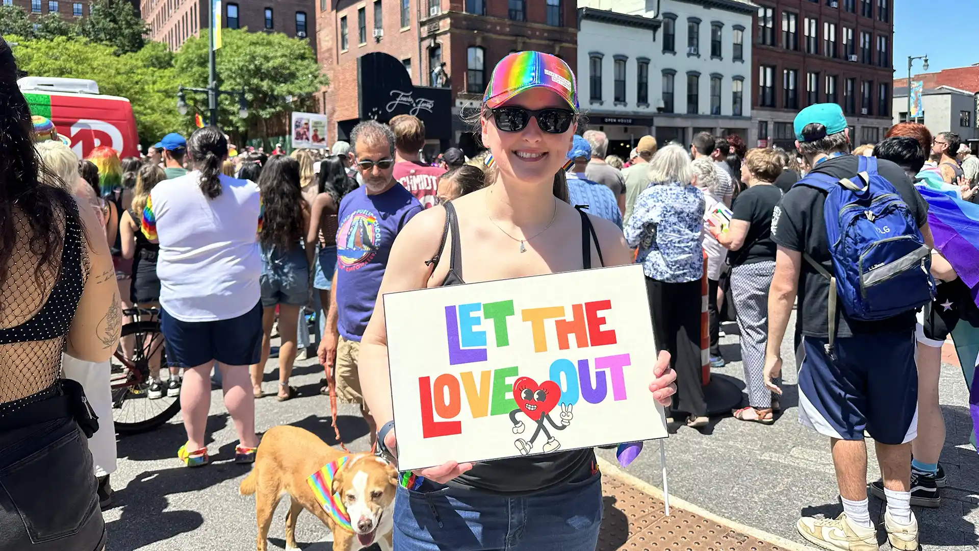 Pride parade goers with posters