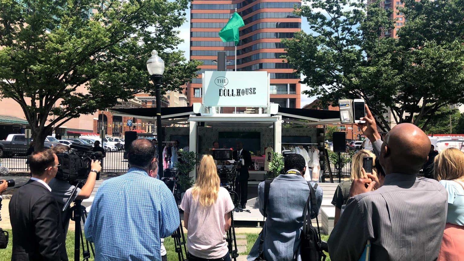 A group of people facing a stage.