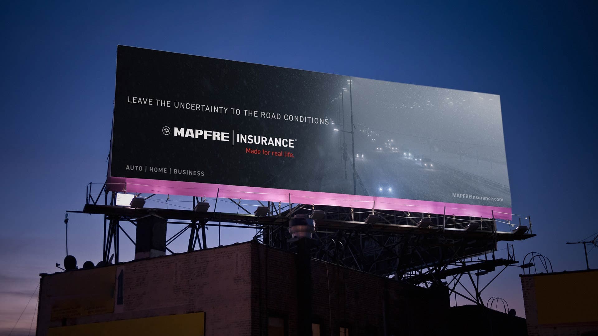 A Mapfre Insurance billboard OOH showing in front of the city skyline.