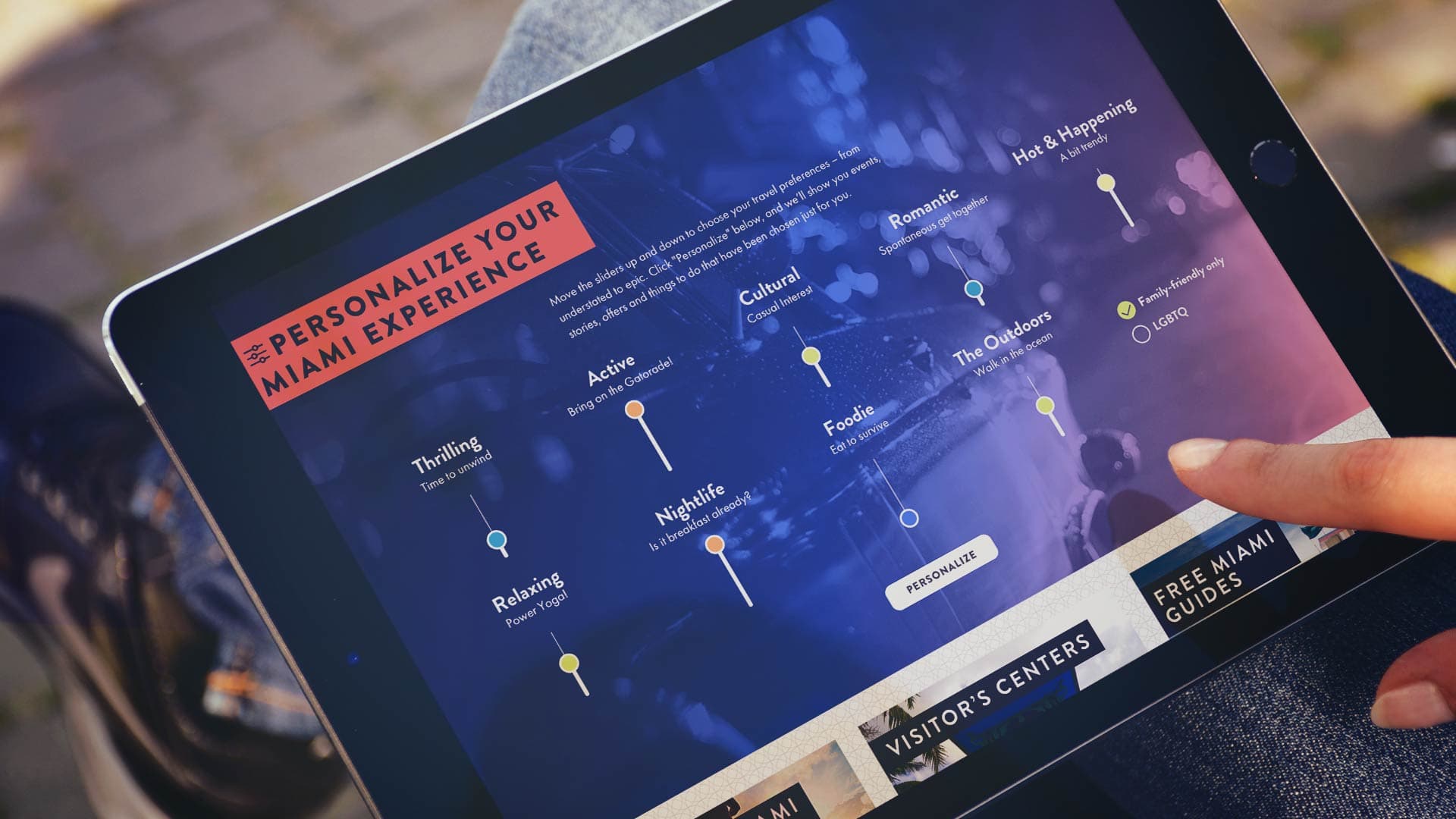 A computer showing a travel site onscreen for Miami.