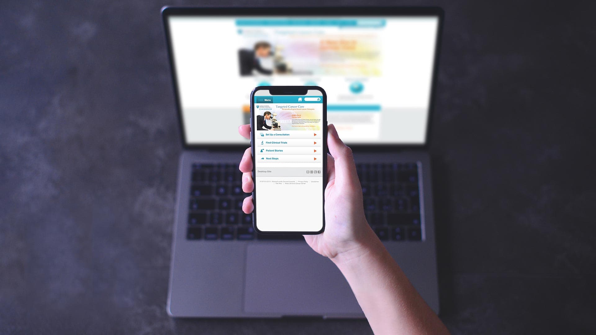 A laptop and smart phone showing a Mass General Hospital website database.