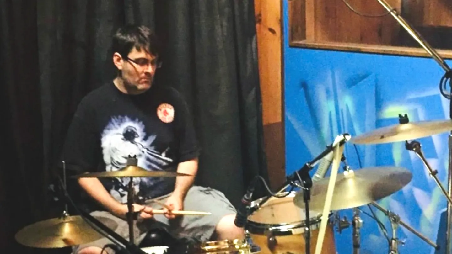 Alec plays drums