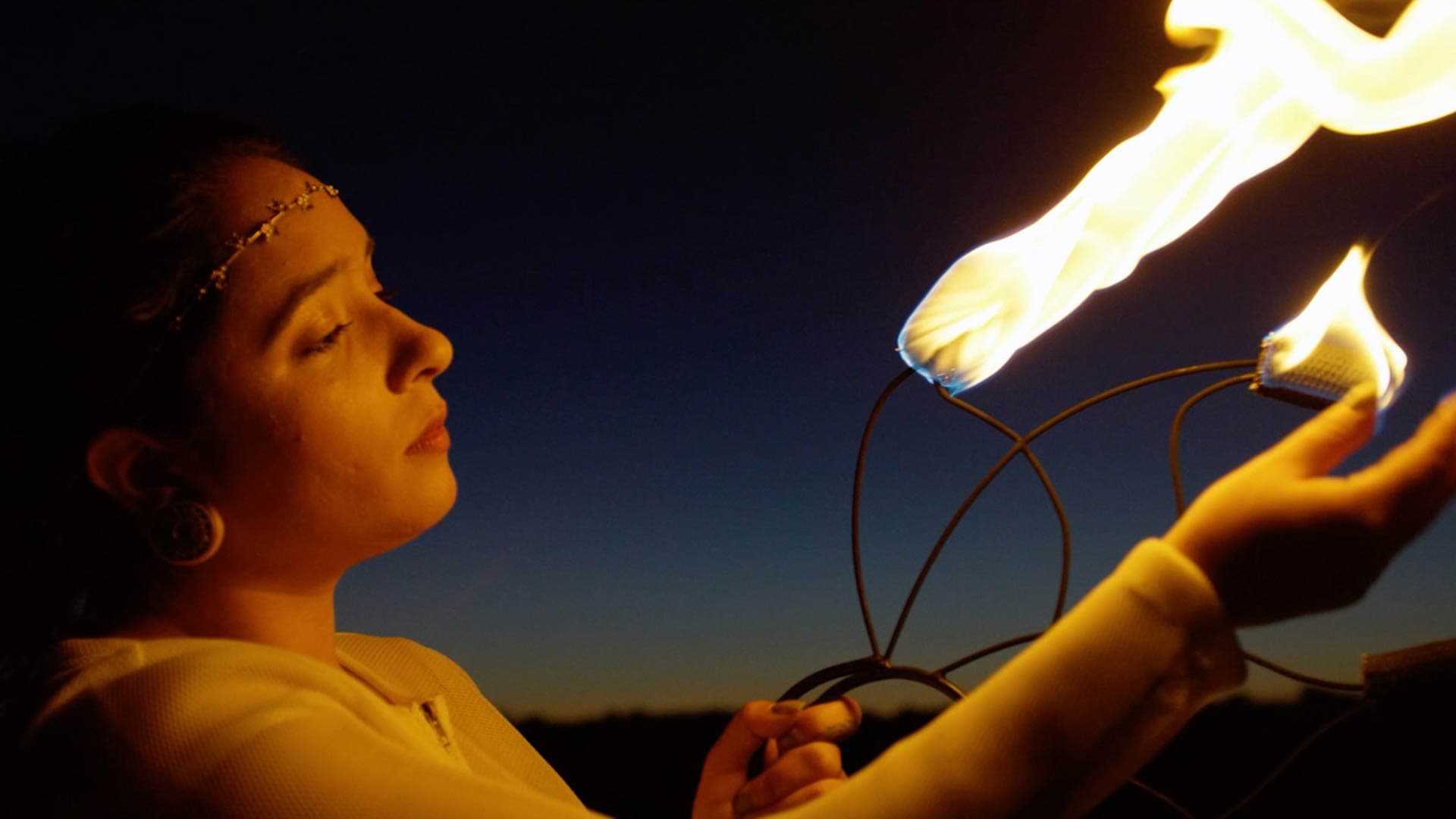 A women holding fire.